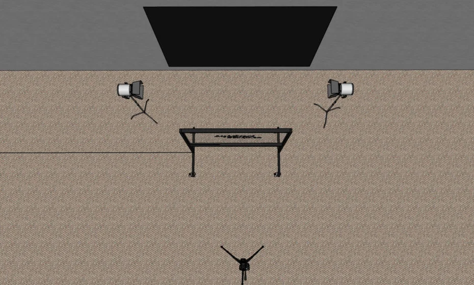 Overhead schematic showing the black backdrop, two lights, lightboard and camera positions.